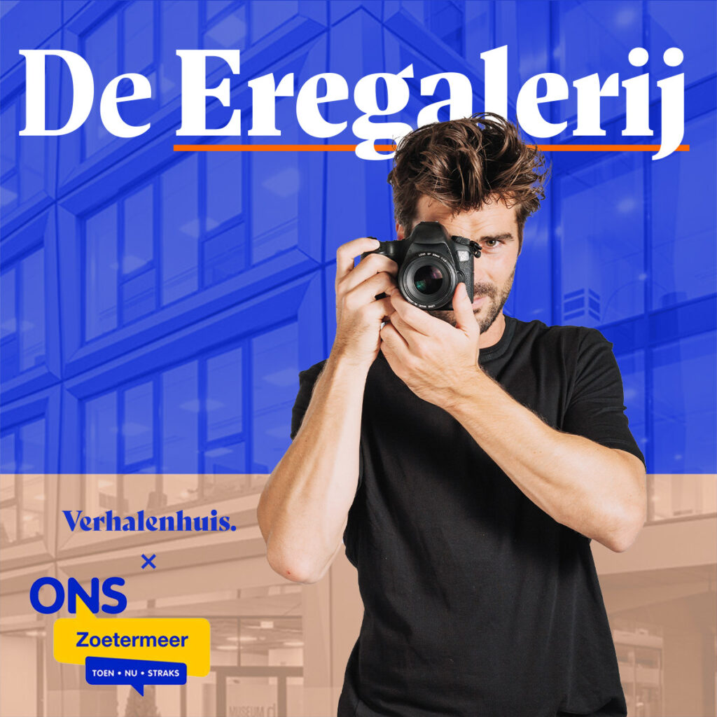 Een fotograaf maakt een gratis portretfoto tijdens het evenement De Eregalerij.